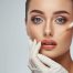 Woman gets beauty facial injections. Mature woman receiving hyaluronic acid treatment. Healthy face skin care beauty, skincare cosmetics, cosmetology concept.