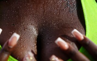 A woman's chest covered in sweat wondering what are the best hyperhidrosis treatments