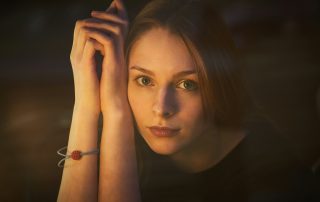 A woman wondering what to choose - polynucleotide treatments vs. traditional anti aging Solutions